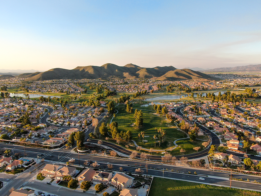 Aerial view of golf course surrounded by town houses and luxury villas during sunset time. Temecula, California, USA