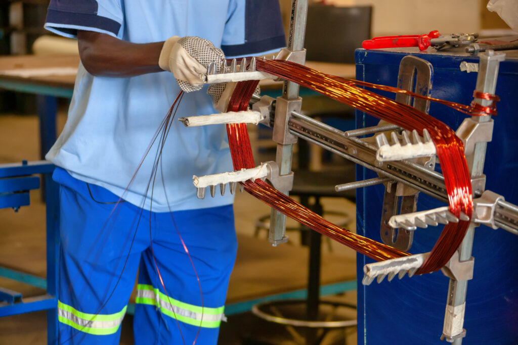 winding copper on the grill to size, rewinding an electric motor