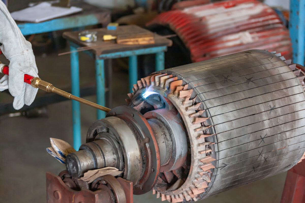 worker performing Repairs via an Electric motor rewinding