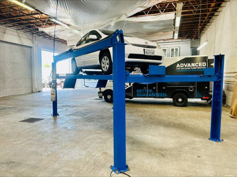 Car on automotive lift that was installed by Advanced Air & Vacuum.