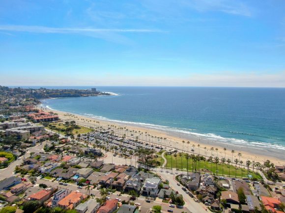 Aerial view of La Jolla coastline with nice small waves and beautiful villas. La Jolla, San Diego, California, USA. Beach with pacific ocean